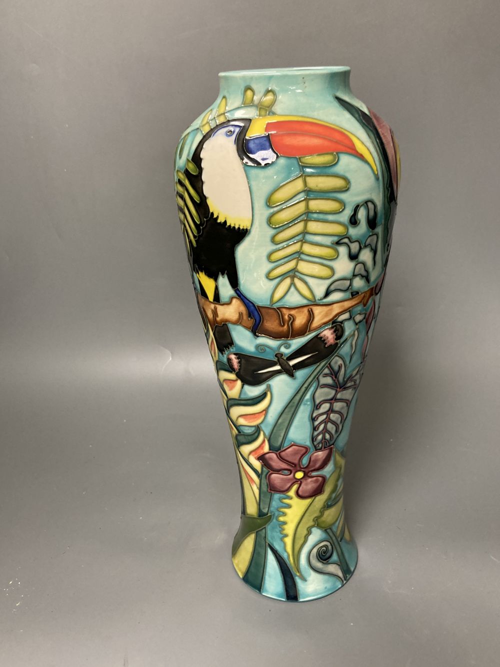 A Moorcroft vase, Jaraqui pattern, designed by Jeanne McDougall, limited edition number 18 of 250, height 37cm, together with origi